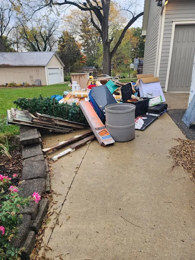 Dumpster being loaded with debris for 30 Yard Dumpster Rental in Waverly
